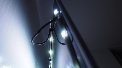 Lights taped to the back of the TV.